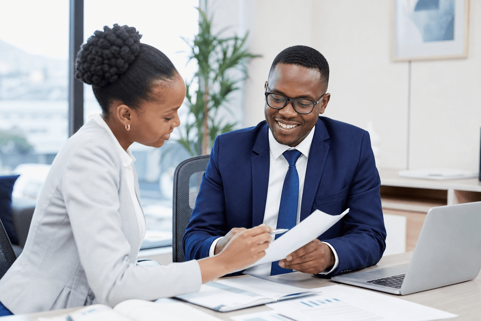 A confident trustee reviewing trust documents with a colleague, protected by APA Trustees Liability Insurance